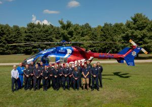 Memorial Mediflight team posing alongside the Medflight helicopter
