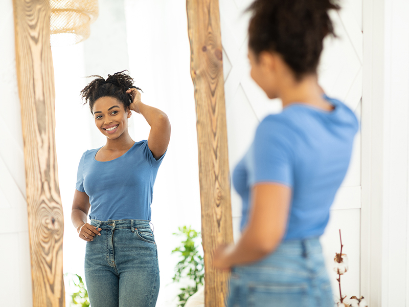 Female,Beauty,And,Self-confidence.,Cheerful,African,Lady,Posing,Near,Mirror