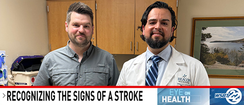 Beacon patient Dylan Friar stands to the left of his neurosurgeon, Jose Lopez, MD.