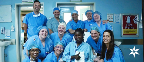 Beacon cardiac team and patient pose in a Nairobi hospital during a May 2026 mission providing heart valve surgeries.