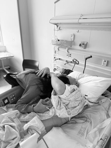 Addy hugging her father, Ryan Hunt, in his hospital room on the day after his cardiac arrest.