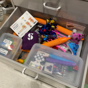Sensory-support cart stocked with tools and resources for neurodivergent patients.