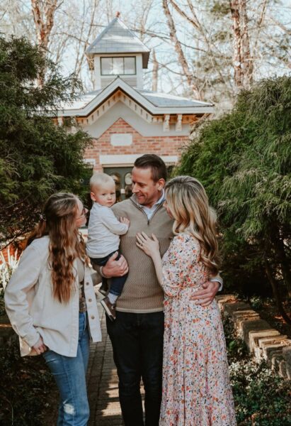 Lee, Jane, Aleks and Dani Hershberger stand together on a garden pathway.