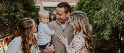 Lee, Jane, Aleks and Dani Hershberger stand together on a garden pathway.