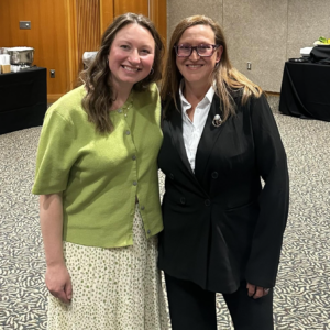 Taylor Harbin, left, stands with lead EMT Laura, who provided care at the 2025 crash scene, during Beacon's Survivors Dinner in May 2026.