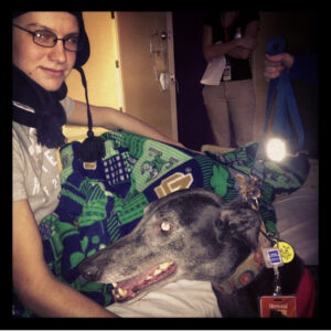 Brock with a therapy dog during cancer treatment in 2012 at Memorial Hospital.